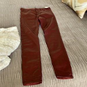 Faux leather high rise jean in dark rust color.